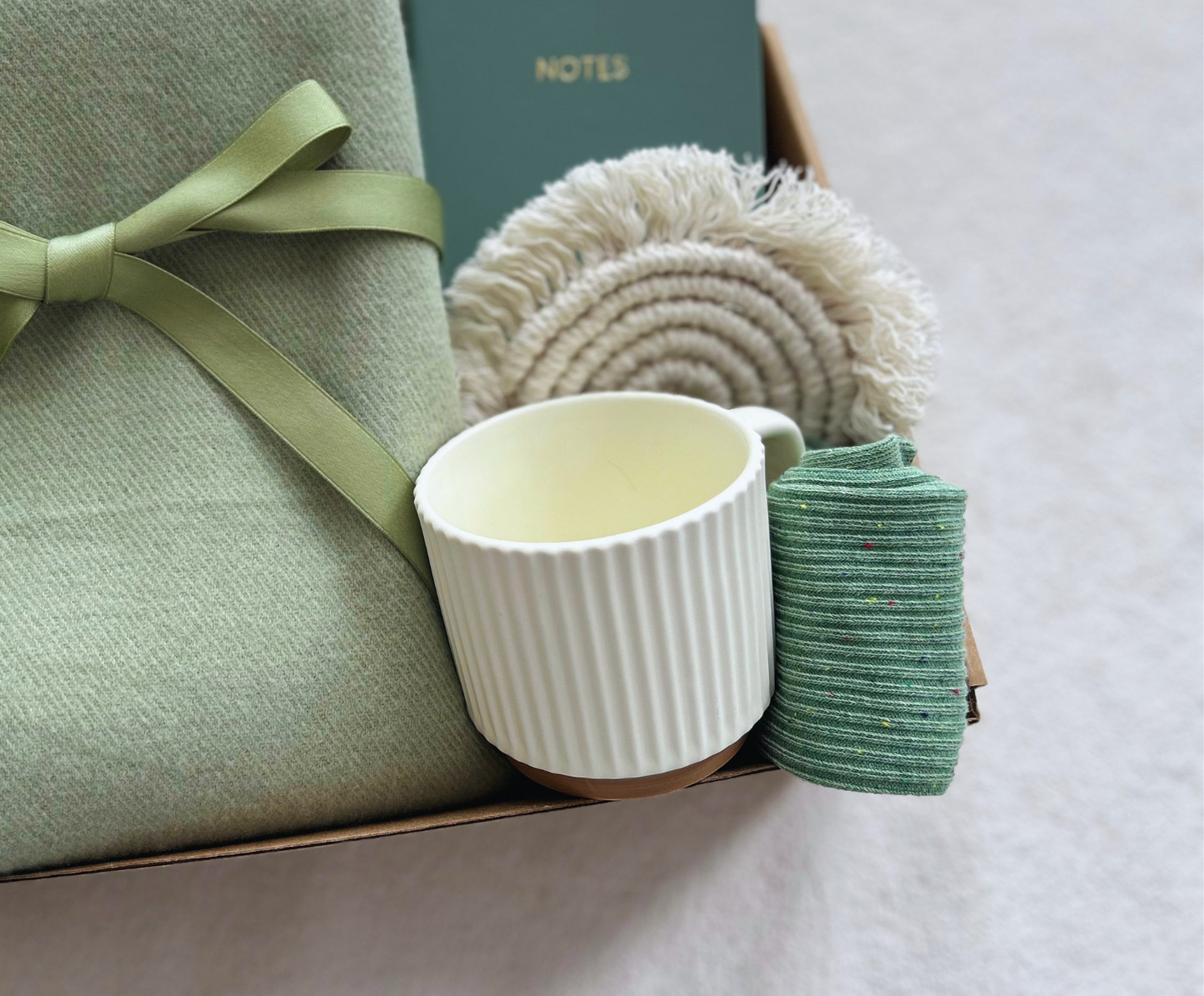 "A Moment of Calm" Green Care Package: Premium Soft Scarf, Wellness Journal & Ceramic Coffee Mug Basketful Gifts