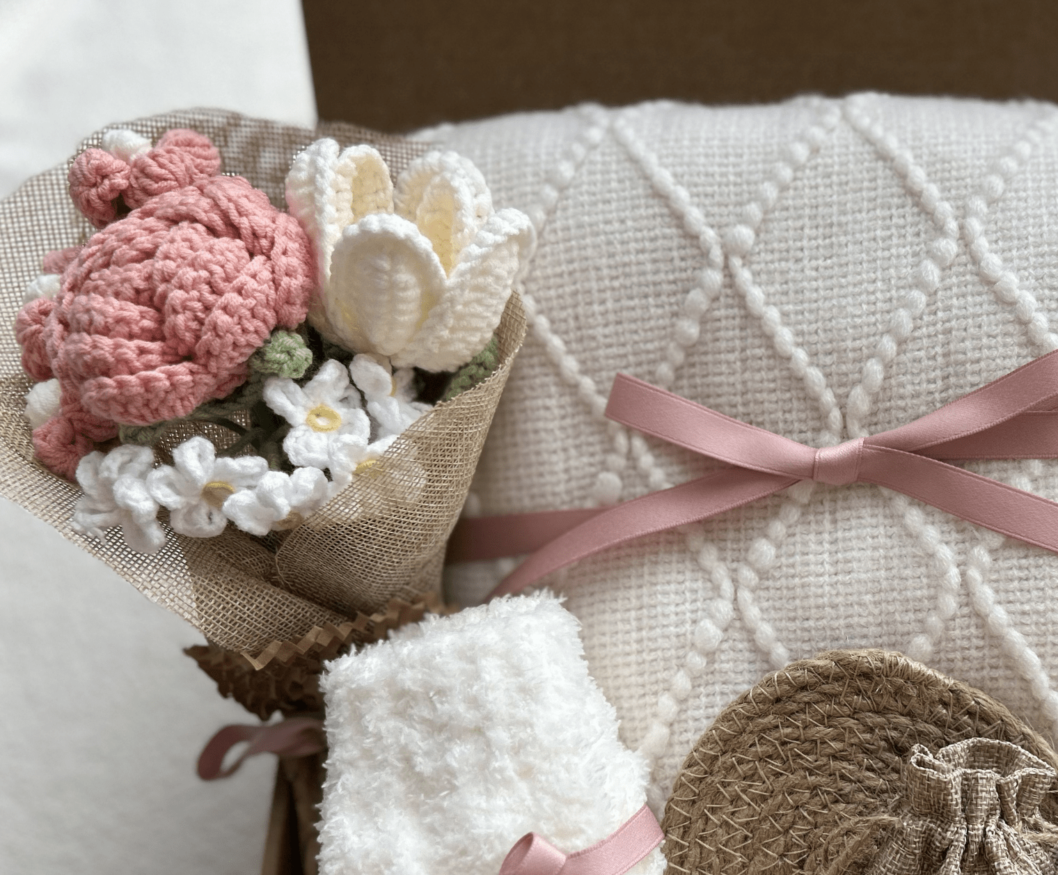 Care package gift basket knitted throw blanket tied with satin ribbon - Basketful Gifts