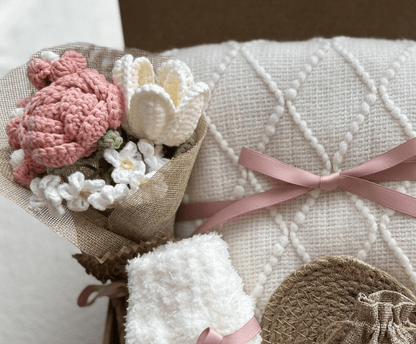 Care package gift basket knitted throw blanket tied with satin ribbon - Basketful Gifts